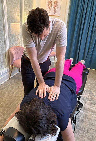 Chiropractor Liberty MO Nick McColgan Adjusting Patient HP